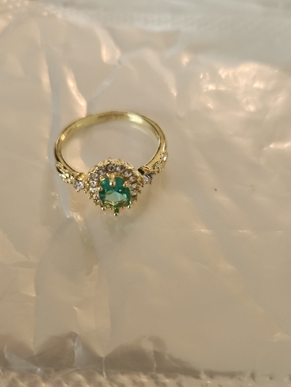 Gold Ring with Green Center Stone and Halo Accent
